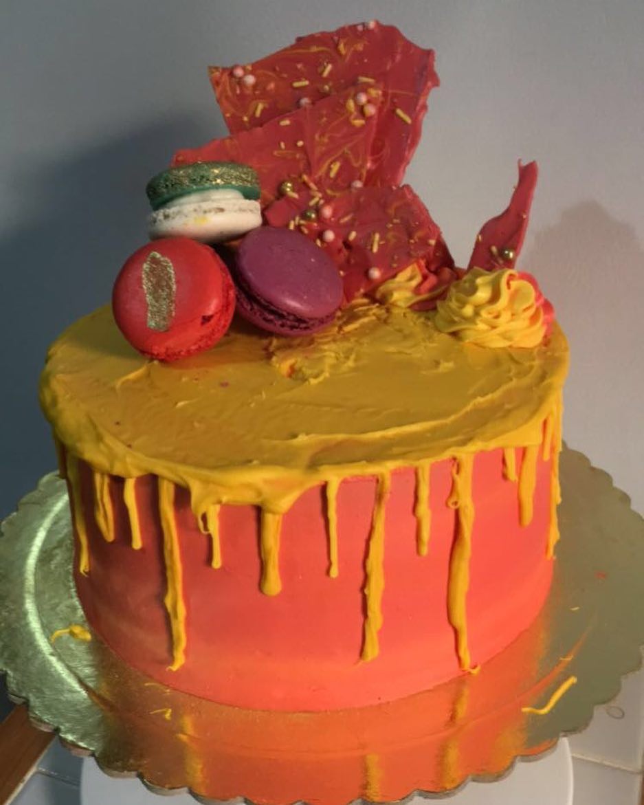 8" vanilla cake with vanilla buttercream, white chocolate drip, white chocolate bark and m