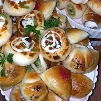 معجنات مشكله وسمبوسه وبيتزا وأقماع