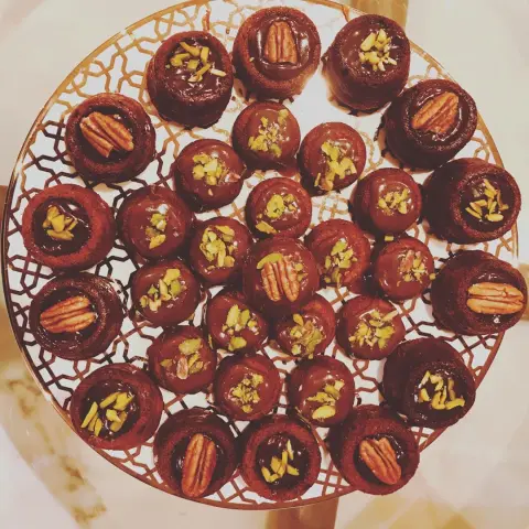 Mini Date Cake filled w/ nuts, topped w/ toffee sauce , & Decorated with pecans and pistachios ✨