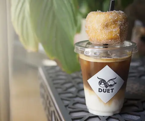 Introducing our new iced Spanish latte in baby owl cups #coffee #latte #duet #spanishlatte #coffeeshop #dounuts